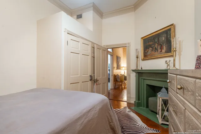 a bedroom with a bed and a fireplace