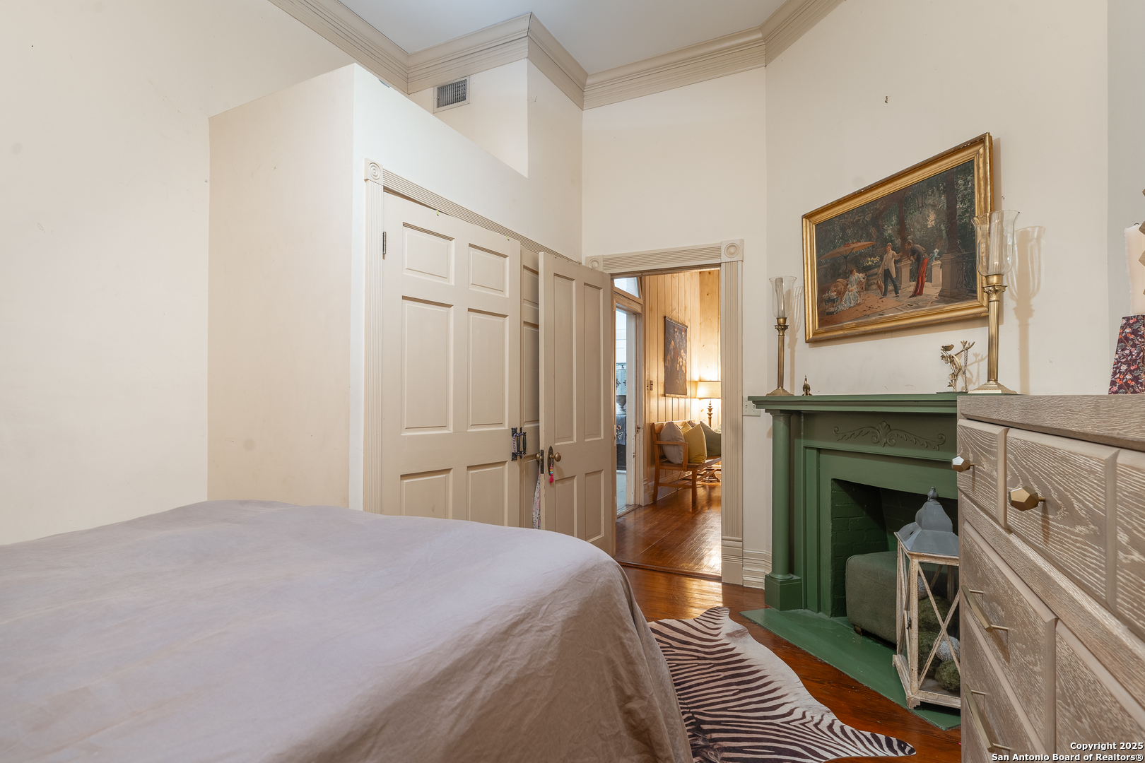 529 North High Street Uvalde, TX 78801 - Photo 24 of 37 a bedroom with a bed and a fireplace