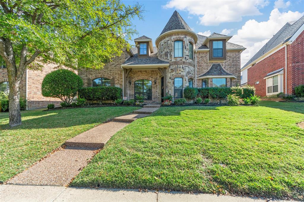 1902 Wilderness Way Allen, TX 75013 - Photo 1 of 34 a front view of a building with garden