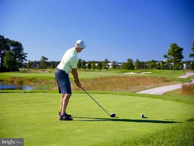 a view of a swimming pool with outdoor seating