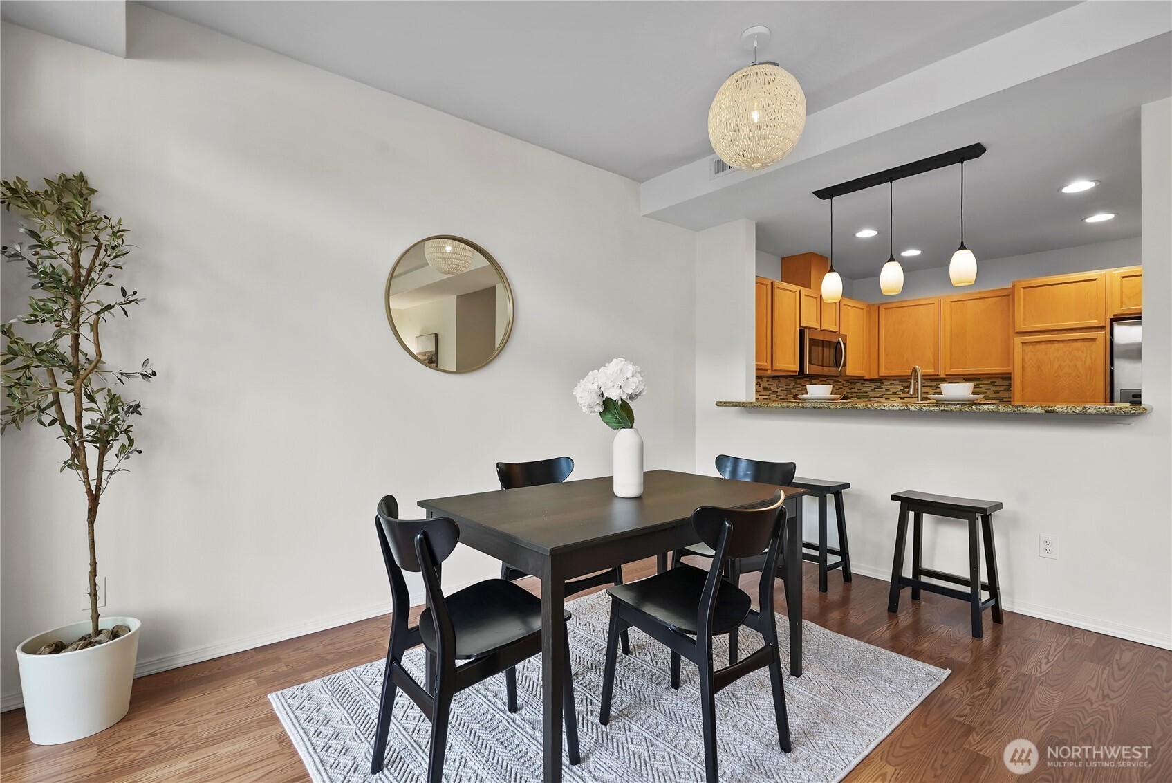 14714 53rd Avenue West, Unit 116 Edmonds, WA 98026 - Photo 11 of 30 a view of a dining room with furniture and wooden floor