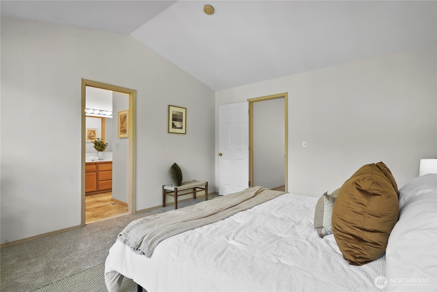 14714 53rd Avenue West, Unit 116 Edmonds, WA 98026 - Photo 15 of 30 a bedroom with a bed and wooden floor