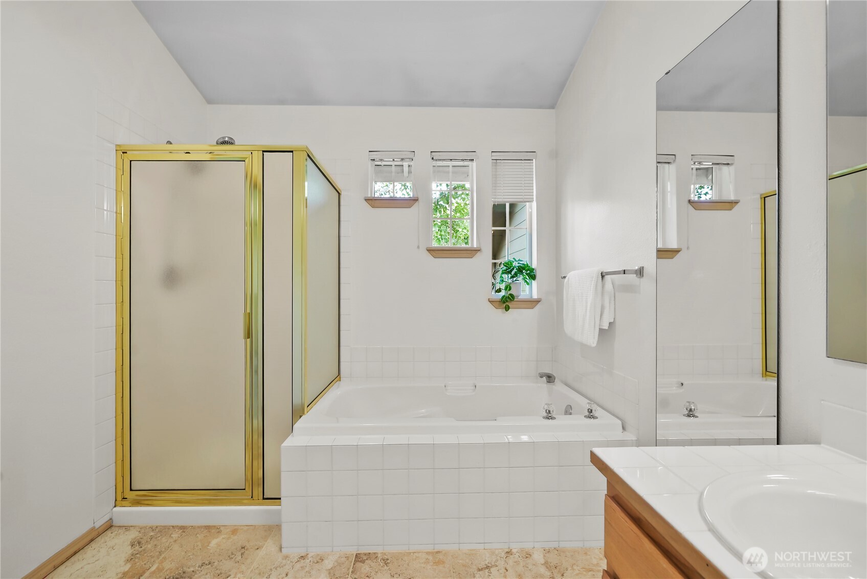 14714 53rd Avenue West, Unit 116 Edmonds, WA 98026 - Photo 16 of 30 a bathroom with a bathtub and a sink
