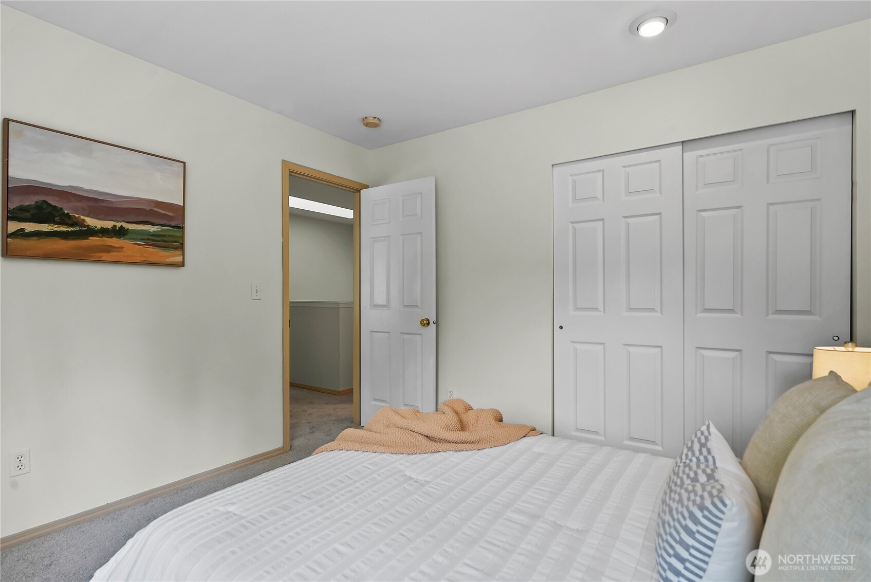 14714 53rd Avenue West, Unit 116 Edmonds, WA 98026 - Photo 21 of 30 a bedroom with a bed and a painting on the wall