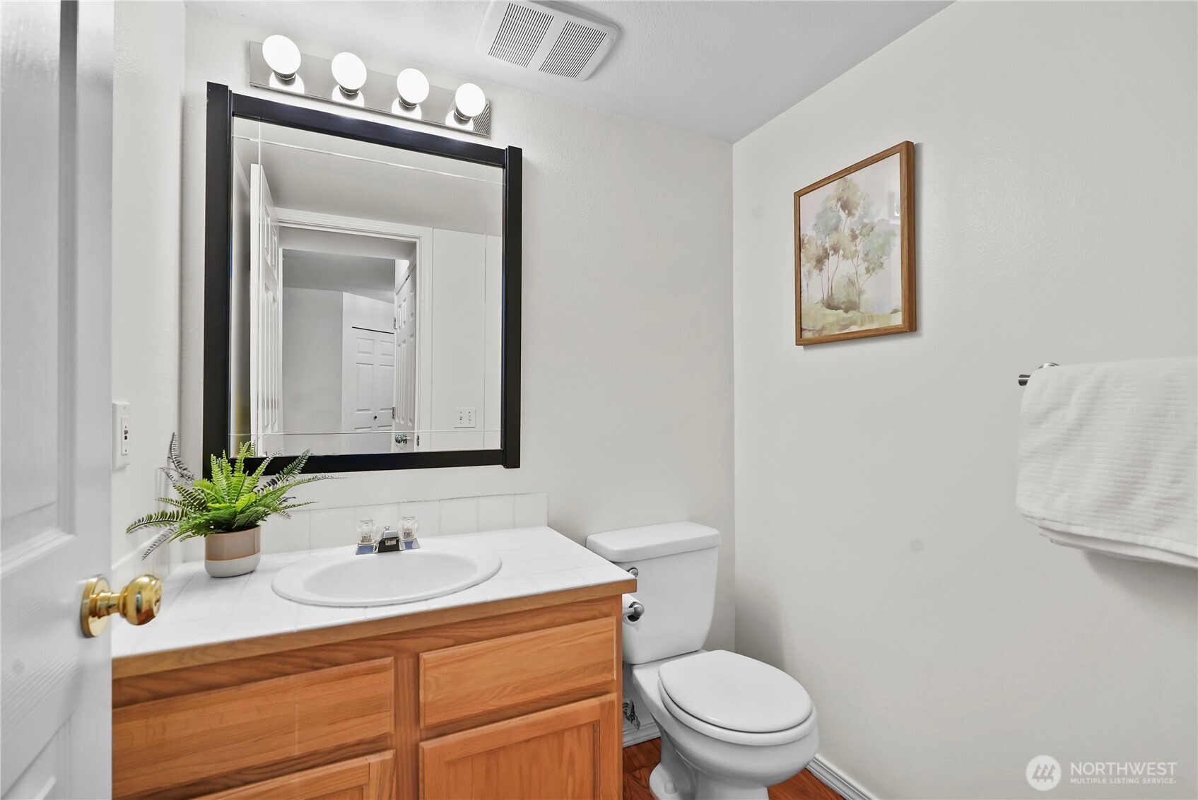 14714 53rd Avenue West, Unit 116 Edmonds, WA 98026 - Photo 25 of 30 a bathroom with a sink a toilet and mirror