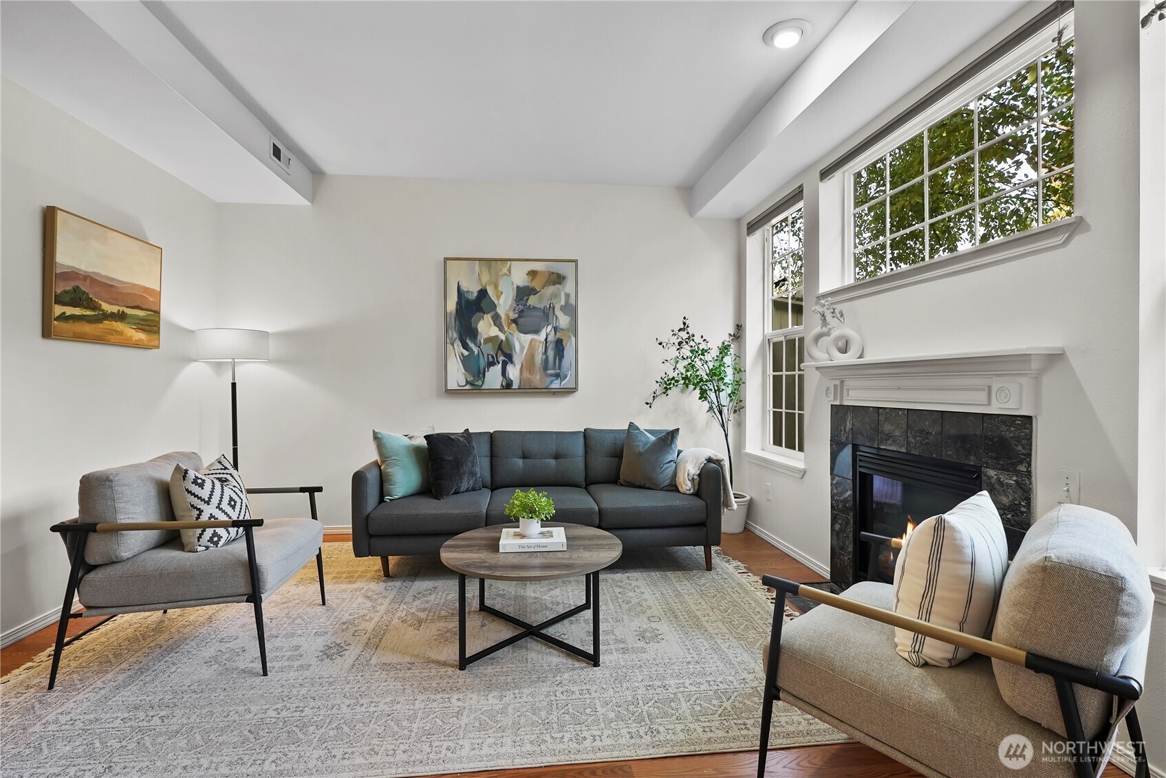 14714 53rd Avenue West, Unit 116 Edmonds, WA 98026 - Photo 5 of 30 a living room with furniture and a fireplace