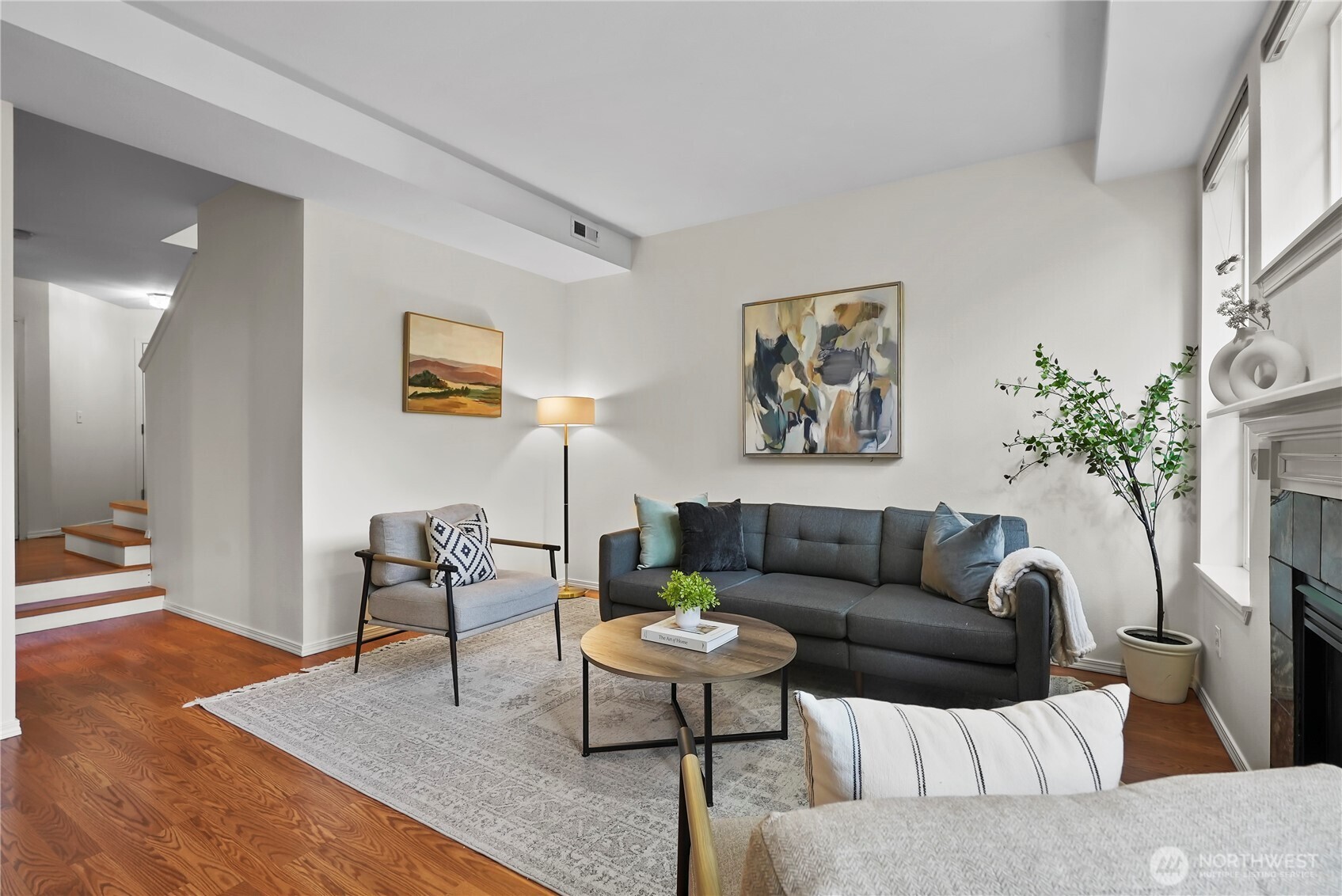 14714 53rd Avenue West, Unit 116 Edmonds, WA 98026 - Photo 6 of 30 a living room with furniture a table and a potted plant