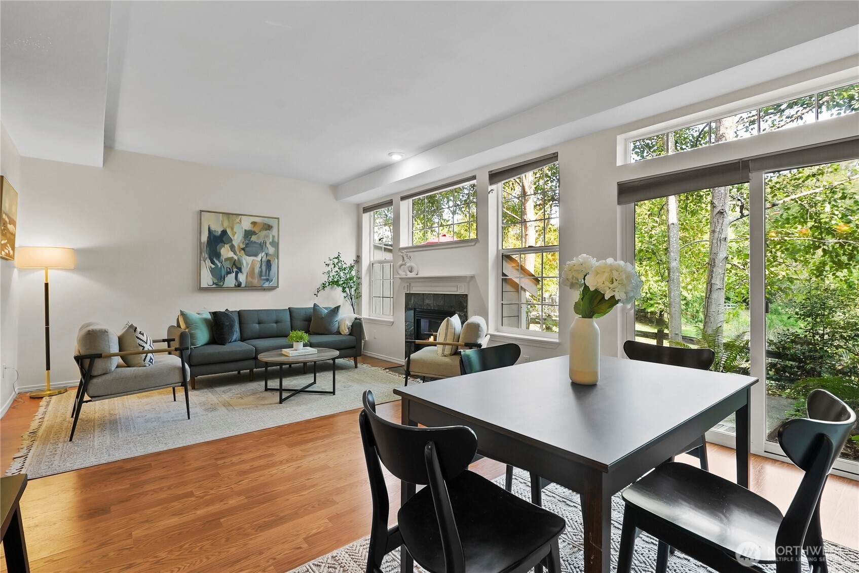14714 53rd Avenue West, Unit 116 Edmonds, WA 98026 - Photo 7 of 30 a view of a dining room with furniture window and wooden floor