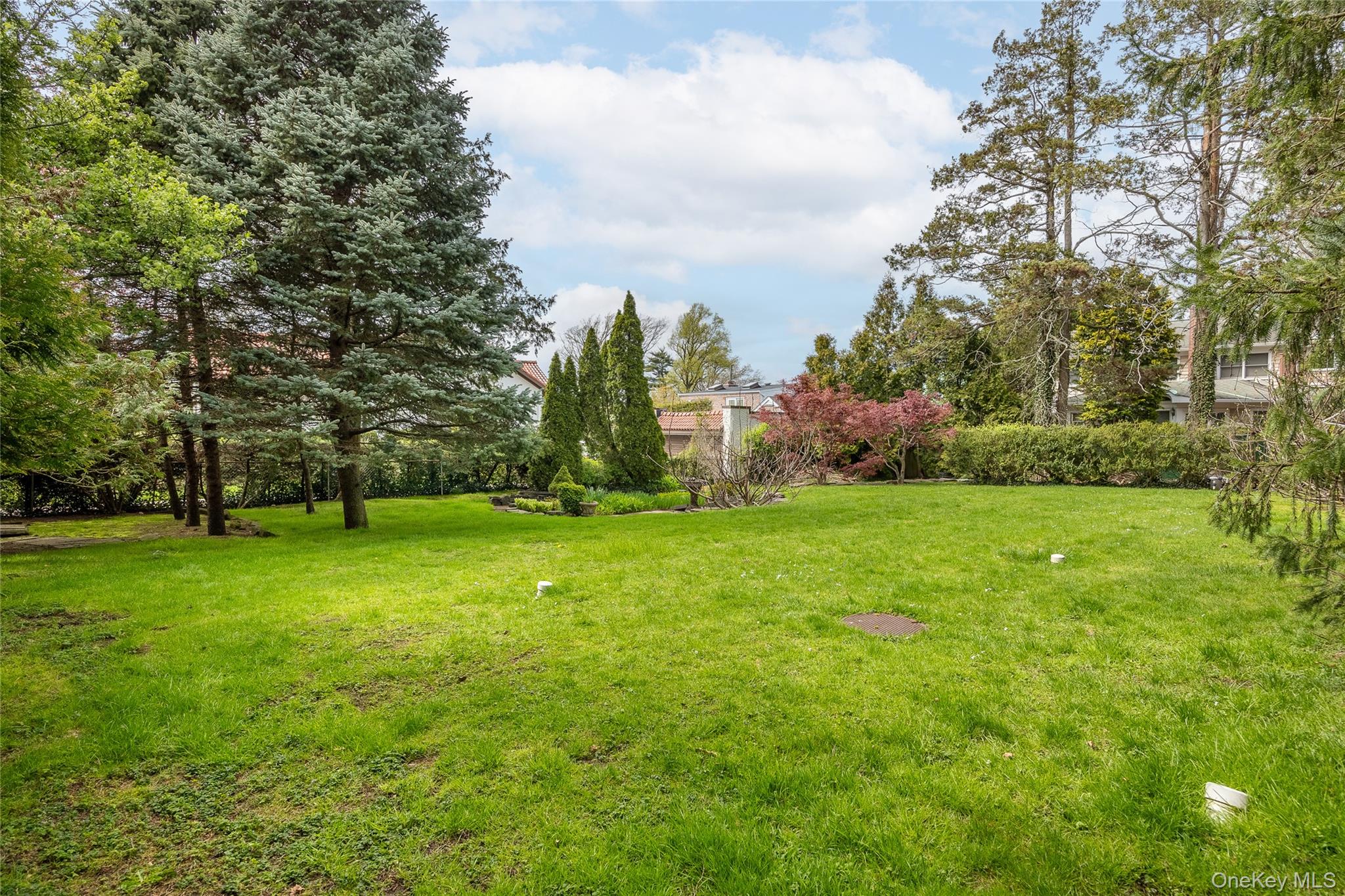 1-27 Beverly Road Queens, NY 11363 - Photo 15 of 46 a view of a field of grass and trees