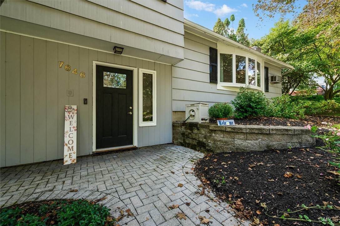 7646 Farmington Road Manlius, NY 13104 - Photo 3 of 47 The front of the home includes a modern brick walk