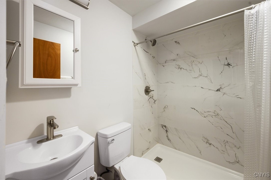 7646 Farmington Road Manlius, NY 13104 - Photo 31 of 47 FIRST FLOOR REMODELED BATHROOM IN 2025 WITH A TILE