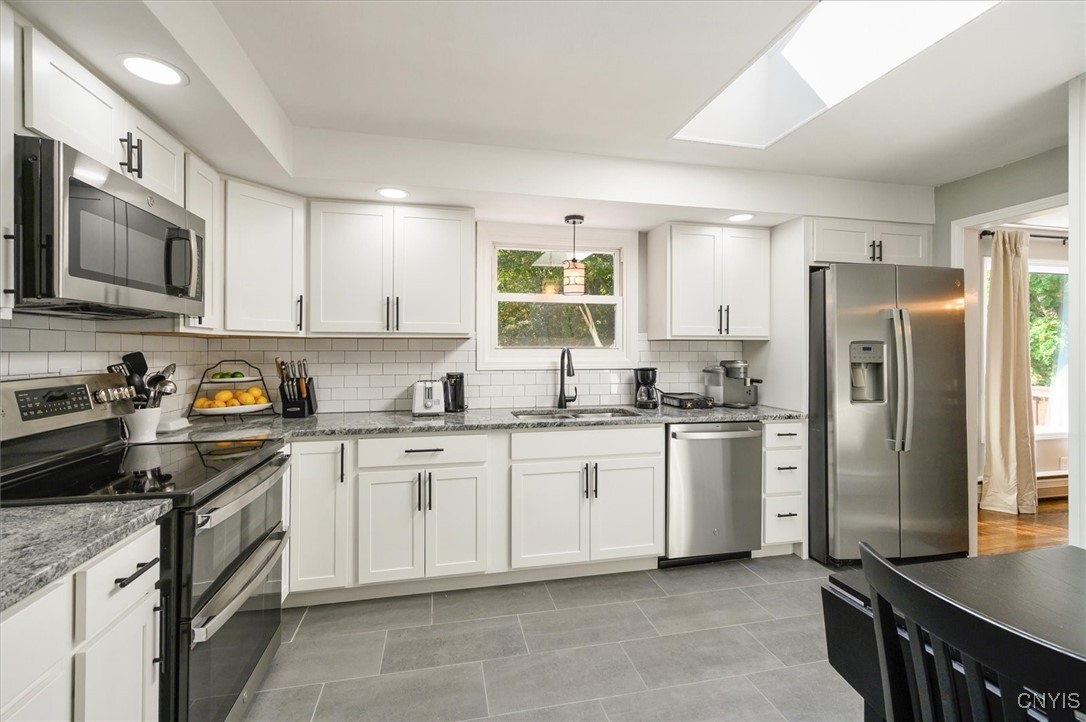 7646 Farmington Road Manlius, NY 13104 - Photo 7 of 47 RECENTLY REMODLELED KITCHEN with a tile floor look