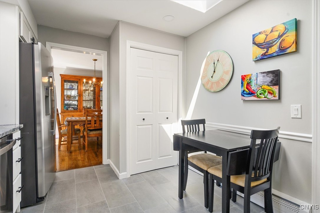 7646 Farmington Road Manlius, NY 13104 - Photo 9 of 47 Eat in Kitchen is bathed in natural light with the