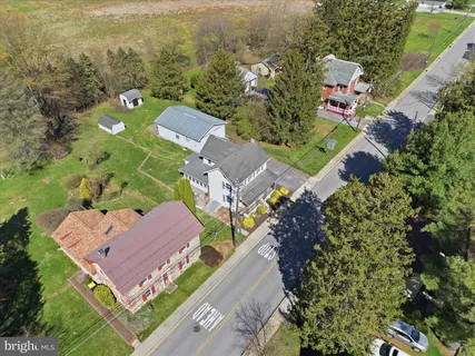 an aerial view of a house with a garden