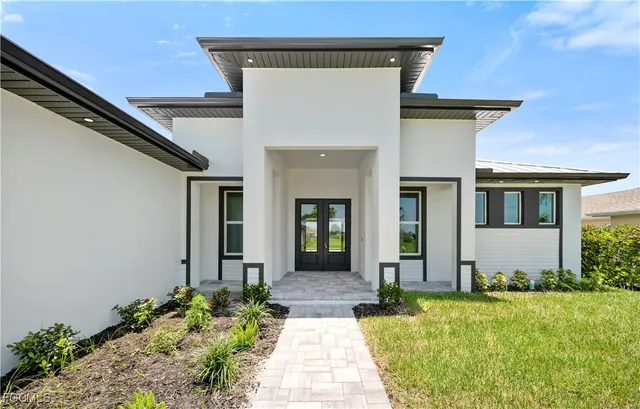 a front view of a house with garden