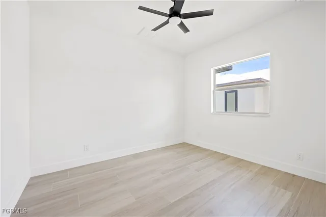 a view of a room with wooden floor and cabinet