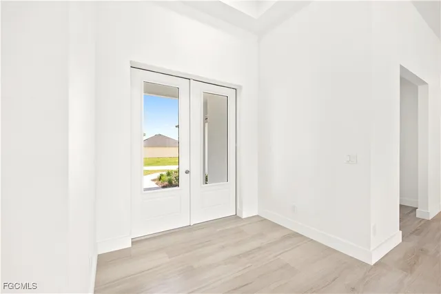 a view of an entryway with wooden floor