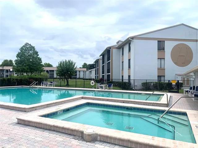 a view of swimming pool with a yard