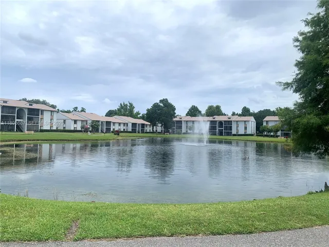 a view of a lake with houses in the background