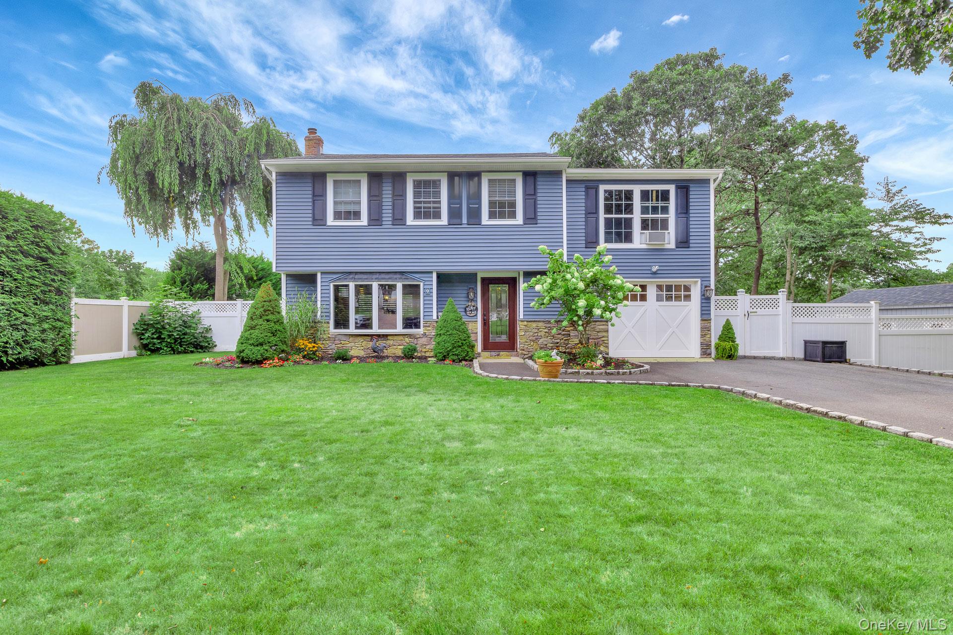 4 Ashford Drive Ridge, NY 11961 - Photo 1 of 1 a front view of a house with a yard