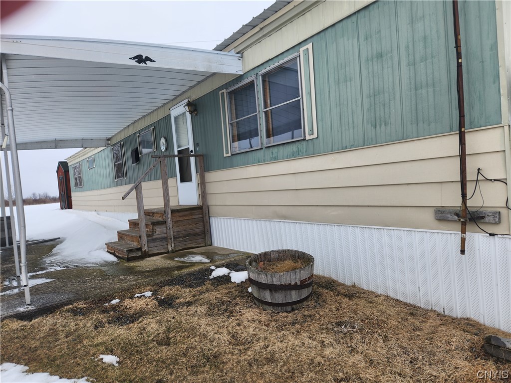 7334 Bourcy Road, Unit 3 Lyme, NY 13693 - Photo 1 of 21 Front with awning