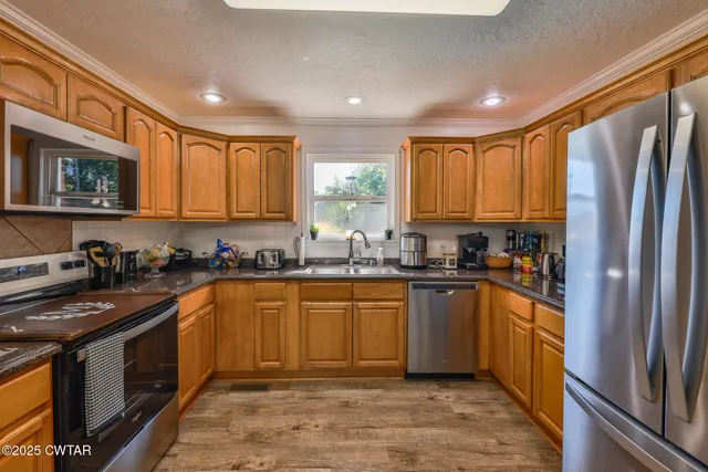 a bedroom with furniture and a ceiling fan