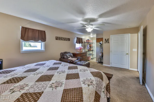 a bed room with furniture and a chandelier