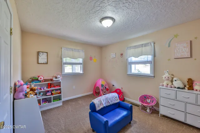 a bedroom with furniture and a couch