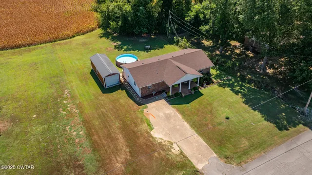a view of a swimming pool with chairs