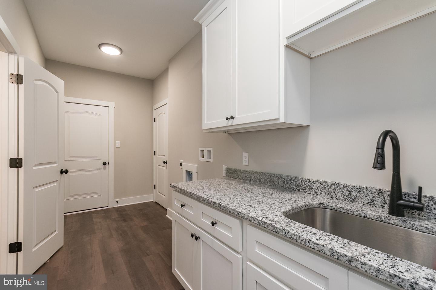 21 Steamboat Run Road Shepherdstown, WV 25443 - Photo 33 of 35 a kitchen with granite countertop a sink and cabinets