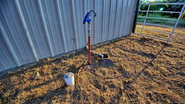 a view of a porch with a table and chairs