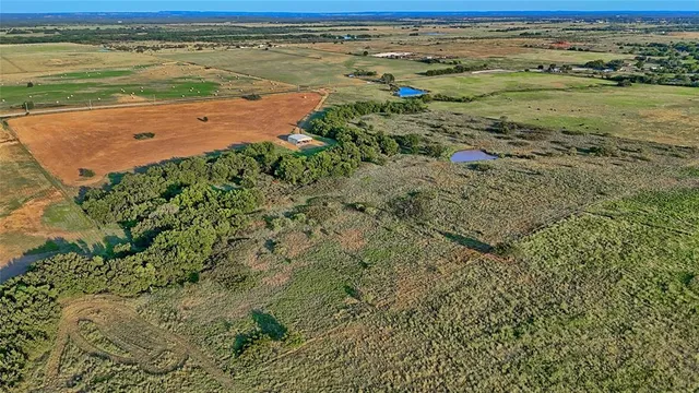 a view of a lake with a yard