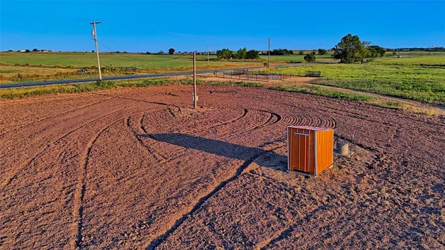 a view of a street with an ocean