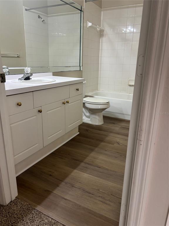 5180 Northridge Road, Unit 105 Sarasota, FL 34238 - Photo 3 of 12 a bathroom with a sink and a mirror