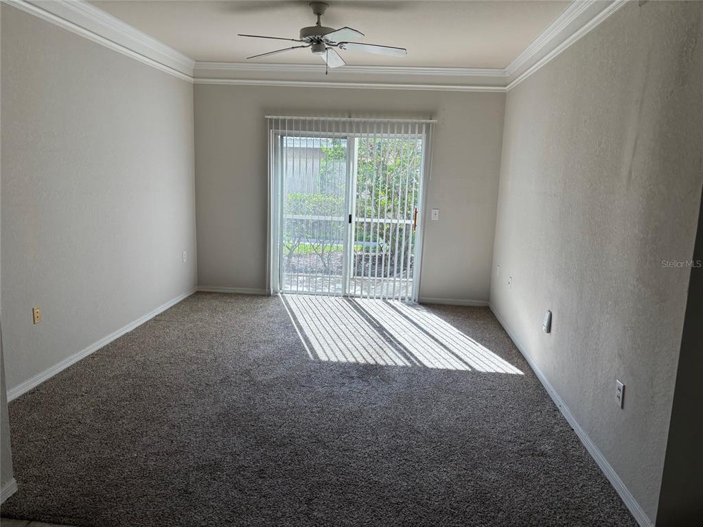 5180 Northridge Road, Unit 105 Sarasota, FL 34238 - Photo 6 of 12 a view of an empty room with a window
