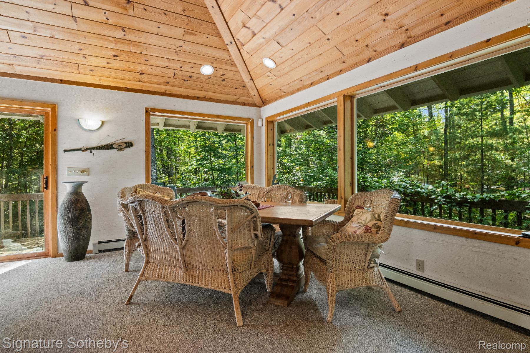 11436 Lakeview Road Northeast Kalkaska, MI 49646 - Photo 9 of 29 Carpeted dining area featuring a baseboard radiator, lofted ceiling, wood ceiling, and recessed lighting
