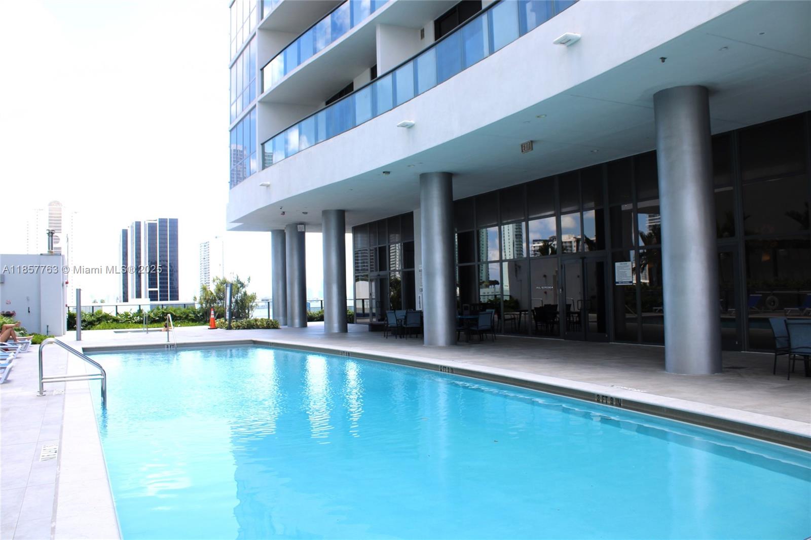 Omni Miami, FL 33132 - Photo 14 of 19 a view of swimming pool with outdoor seating