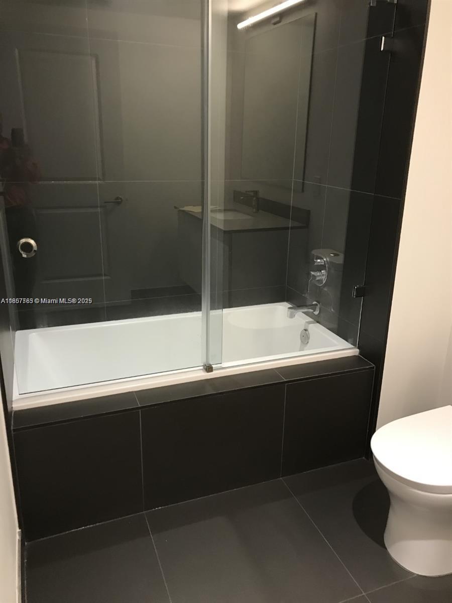 Omni Miami, FL 33132 - Photo 5 of 19 a bathroom with a sink and a mirror