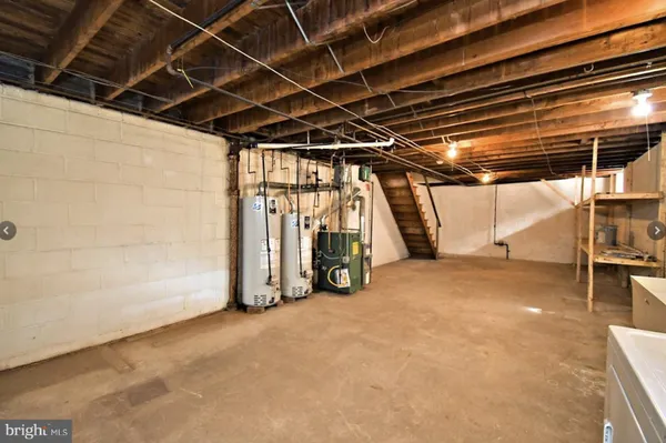 a view of empty room with wooden walls