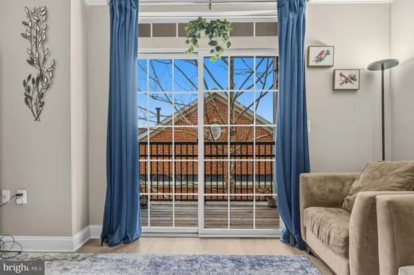 a view of a livingroom with furniture and window