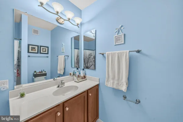 a bathroom with a toilet and a shower curtain