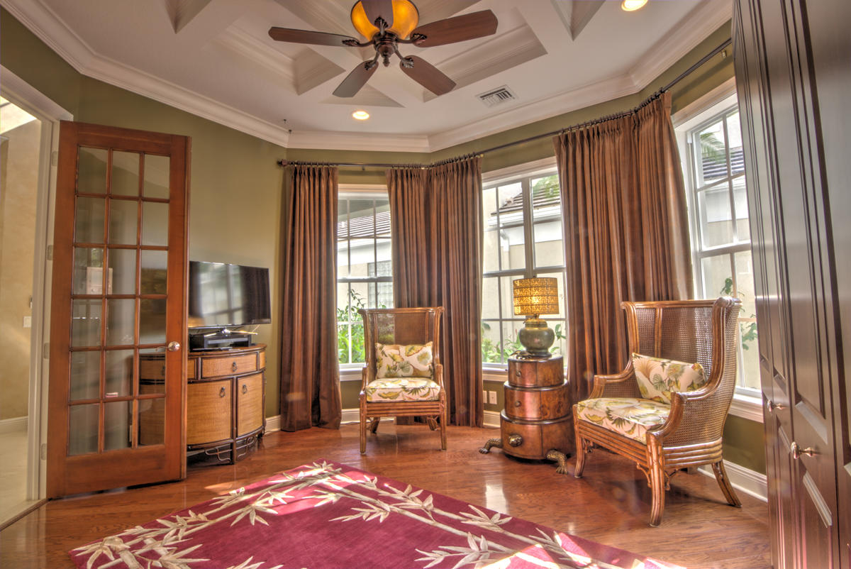 17106 Bay Street Jupiter, FL 33477 - Photo 15 of 52 a living room with furniture and large windows