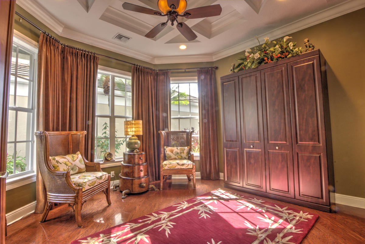 17106 Bay Street Jupiter, FL 33477 - Photo 16 of 52 a living room with furniture and a chandelier