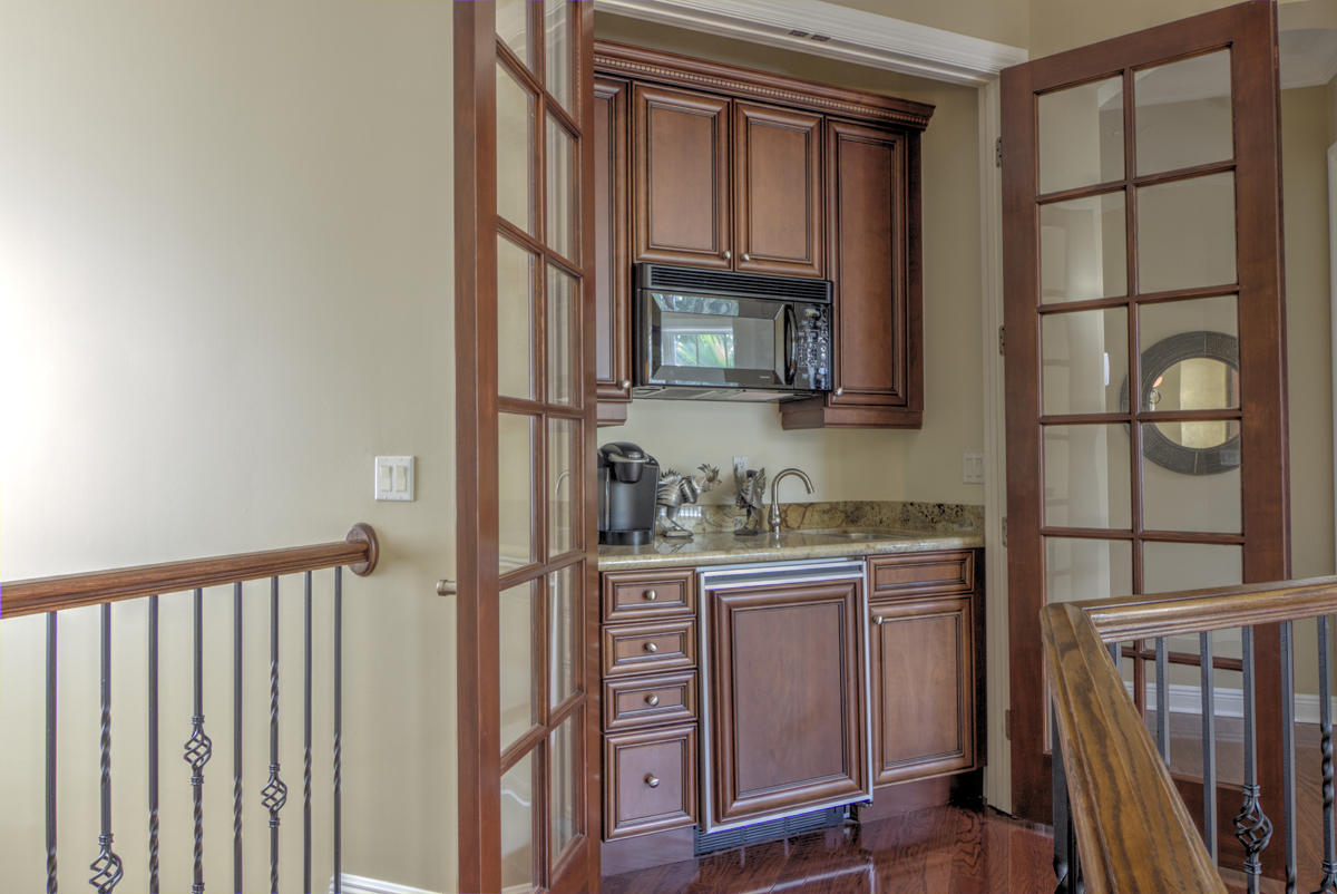 17106 Bay Street Jupiter, FL 33477 - Photo 19 of 52 a kitchen with stainless steel appliances granite countertop a refrigerator and a stove top oven