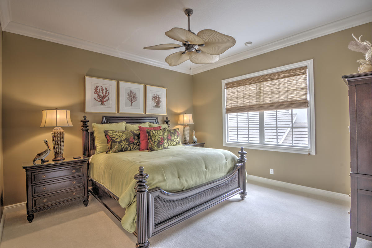 17106 Bay Street Jupiter, FL 33477 - Photo 20 of 52 a bedroom with a bed and window