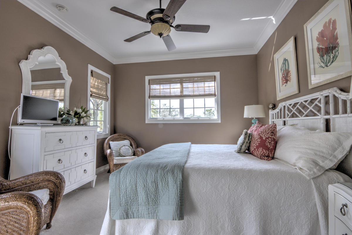 17106 Bay Street Jupiter, FL 33477 - Photo 22 of 52 a bedroom with a bed and a window