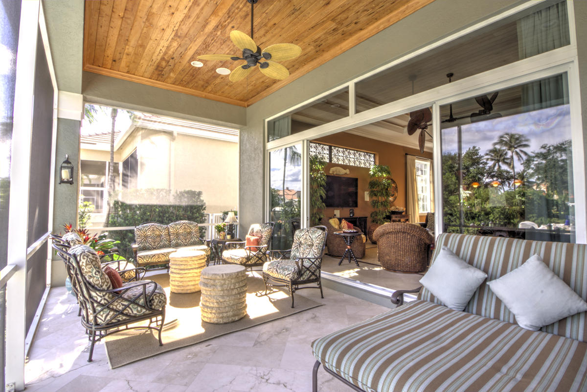 17106 Bay Street Jupiter, FL 33477 - Photo 26 of 52 a living room with furniture and a large window