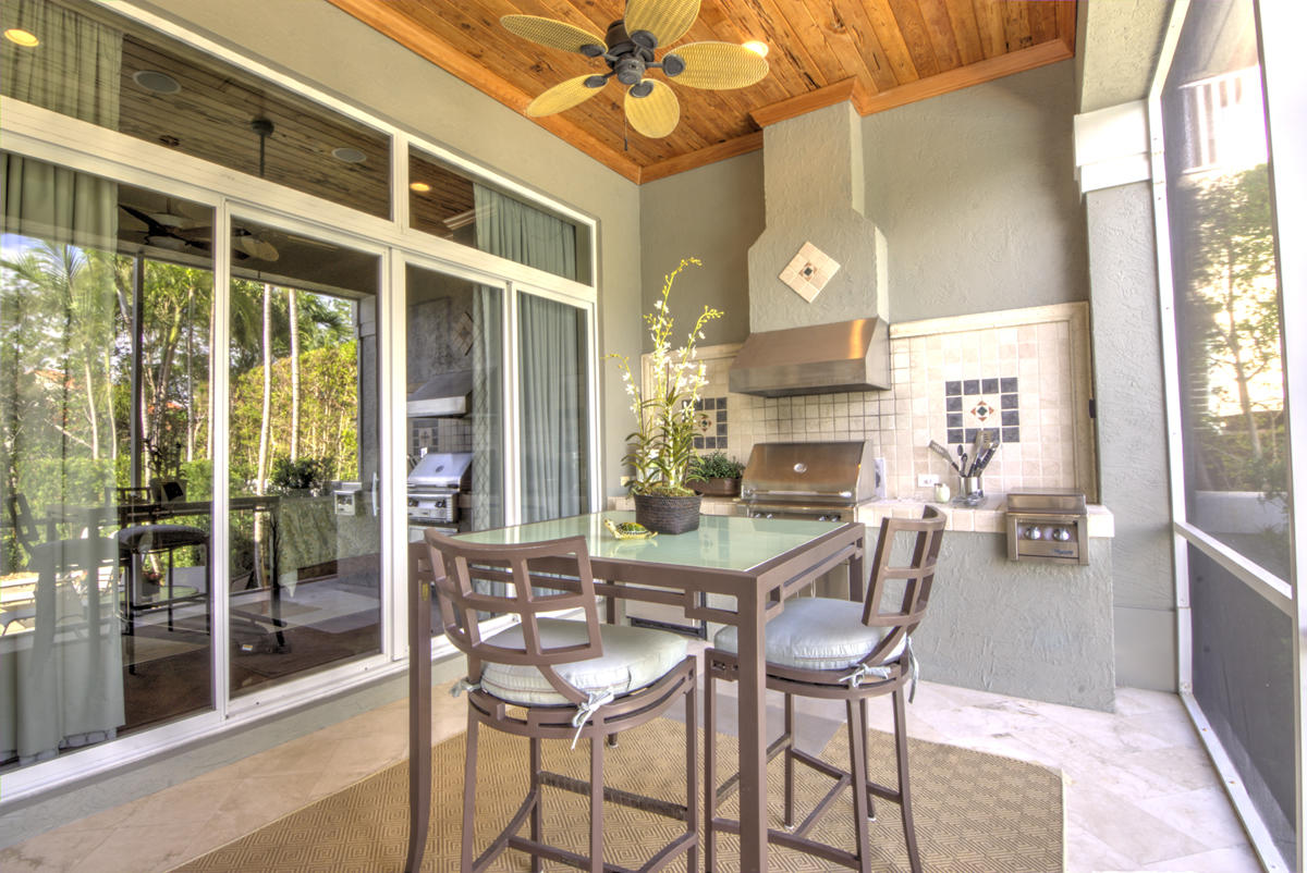 17106 Bay Street Jupiter, FL 33477 - Photo 27 of 52 a view of a dining room with furniture wooden floor and a chandelier