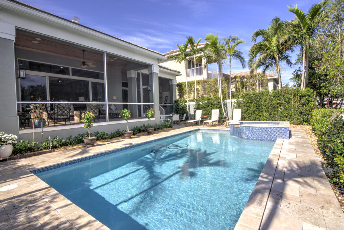 17106 Bay Street Jupiter, FL 33477 - Photo 29 of 52 a swimming pool with outdoor seating and yard