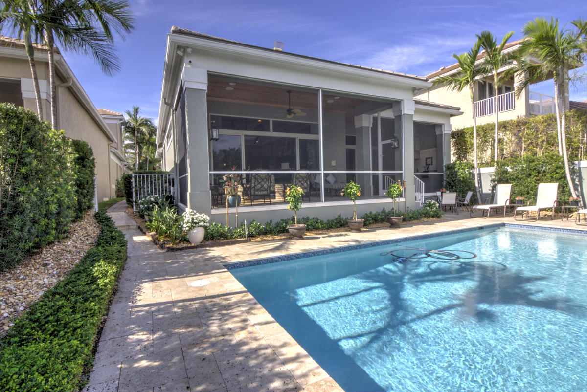 17106 Bay Street Jupiter, FL 33477 - Photo 30 of 52 a swimming pool with outdoor seating and yard